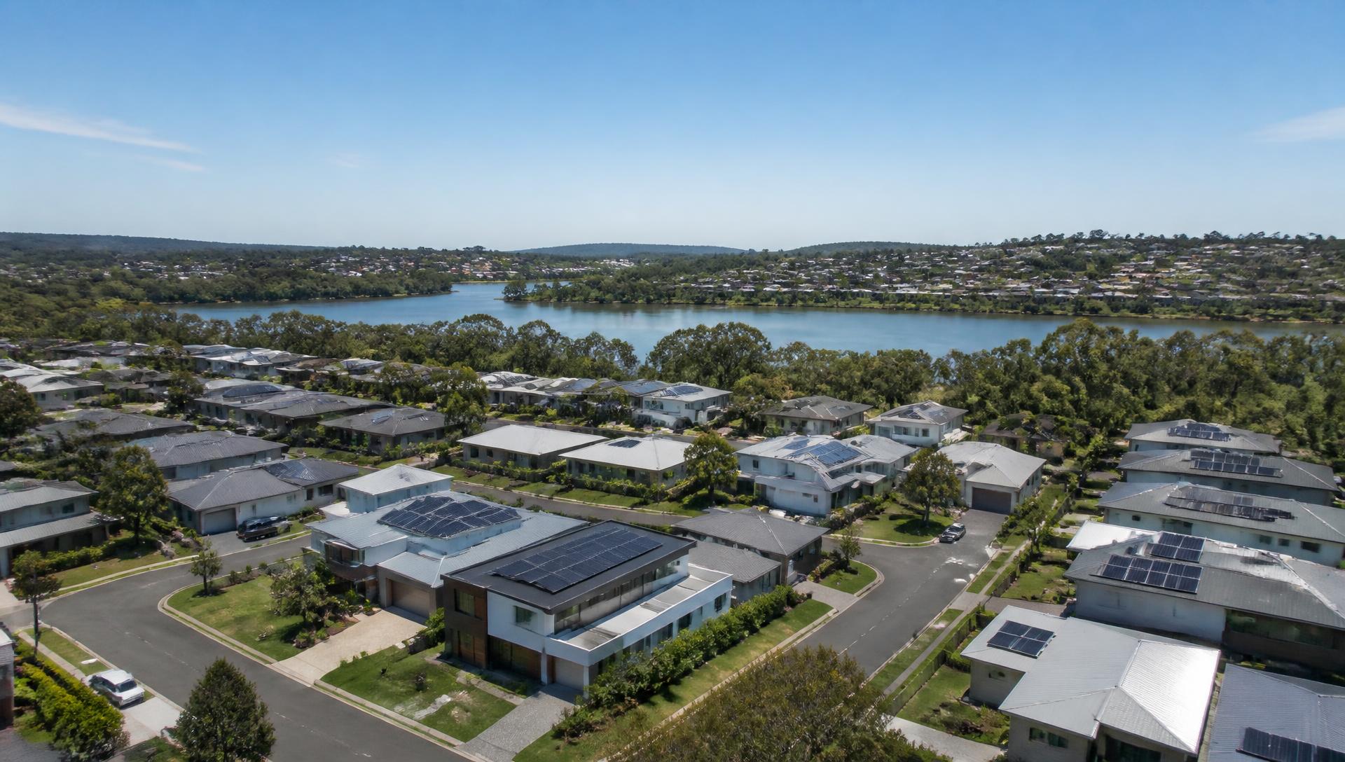 Australian neighbourhood in daylight with rooftop solar systems participating in a connected energy network